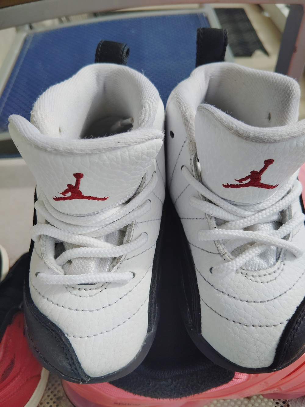 Nike Jordan Kids' White and Black Basketball Shoes with Red Logo